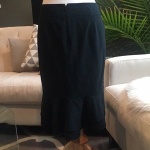 Black pencil skirt with back ruffle
